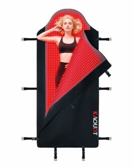 Person lying on a red light therapy mat
