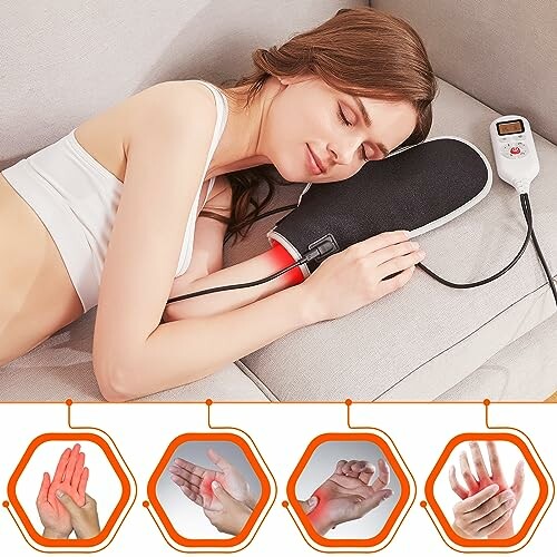 Woman using an electric heating pad on her arm